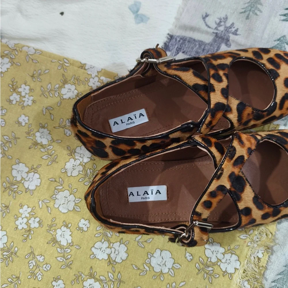Alaia Leopard-Print Mary Jane Flats in Brown and Black